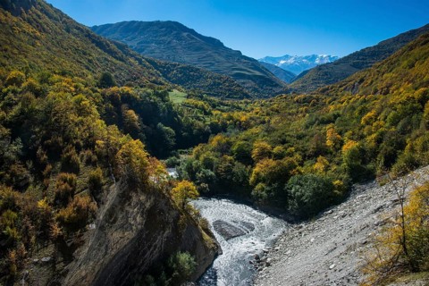 The caucasian mountains in fall with the Argun river
