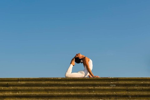 Young woman practising Hatha yoga