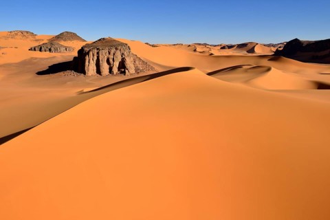 The sand dunes and rocks of Moul Naga
