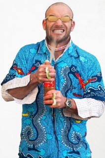 Man holding squirting soda bottle
