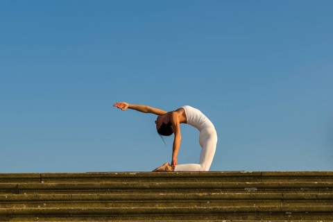 Young woman practising Hatha yoga