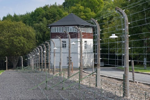 Reconstructed camp fence with watchtower