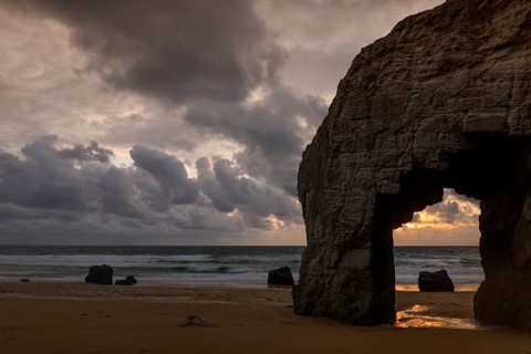 Port Blanc natural arch at sunset