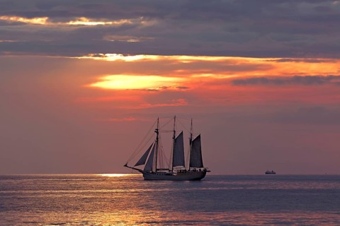 Evening sailing with three-masted schooner Mare Frisium in the foreground