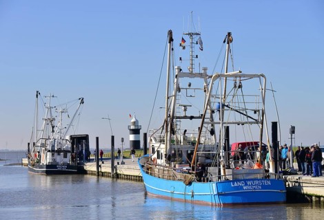 Cutters in the harbour with Kleiner Preusse or Little Prussian Lighthouse