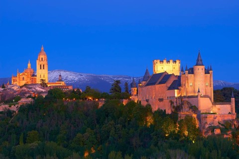 Alcazar fortress and cathedral at dusk
