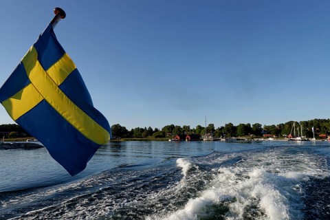 Ship with Swedish flag off Husaro