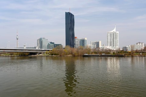 Donauturm or Danube Tower and Kaisermuhlen district with UNO City