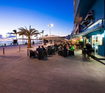 Coastal town of Puerto De Naos with restaurants in the evening