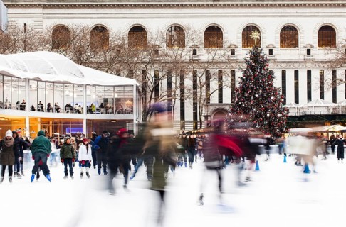 Skating in Bryant Park with the Public Library at the back