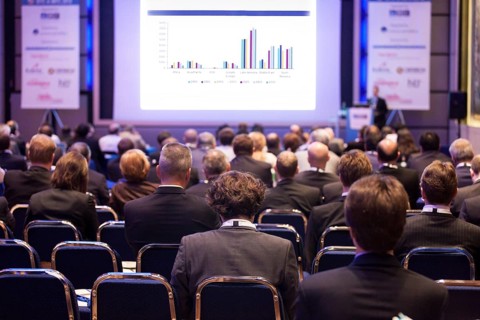Delegates watching a business presentation during a conference