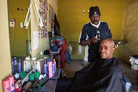 Local hairdresser cutting a customer's hair