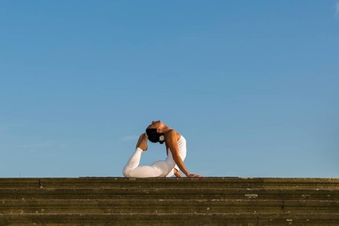 Young woman practising Hatha yoga