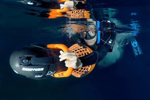 Freediver with an underwater scooter