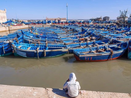 Old blue fishing boats in the port of Essaouira