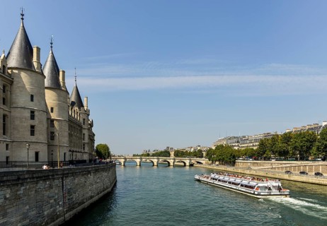 Conciergerie and a cruise ship on the Seine
