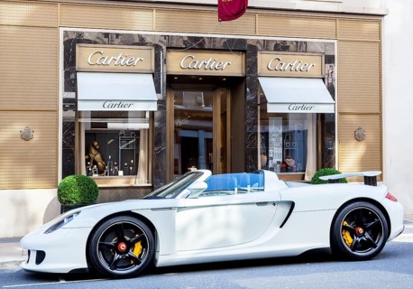 Porsche Carrera GT parked in front of the Cartier jewelry store