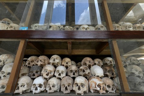Skulls and bones in the Memorial Stupa to the prisoners murdered by the Communist or Maoist Khmer Rouge in Choeung Ek