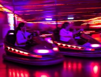 Two bumper cars at night