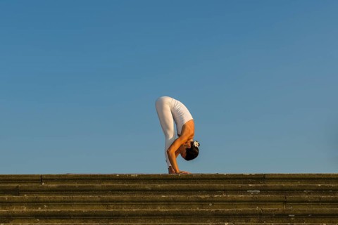 Young woman practising Hatha yoga