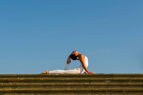 Young woman practising Hatha yoga
