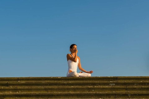 Young woman practising Hatha yoga