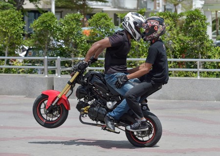Motorcycle stunt rider performing