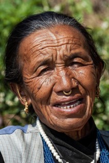 Nepalese woman with earrings and nose piercing