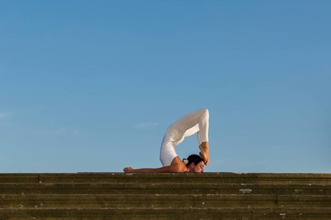 Young woman practising Hatha yoga