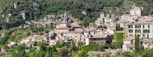 Valldemossa with the Carthusian Valldemossa Charterhouse and the parish church of Sant Bartomeu