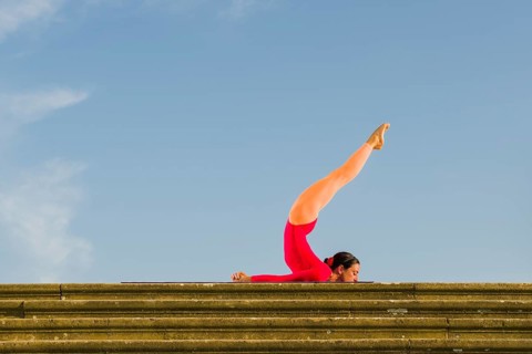 Young woman practising Hatha yoga