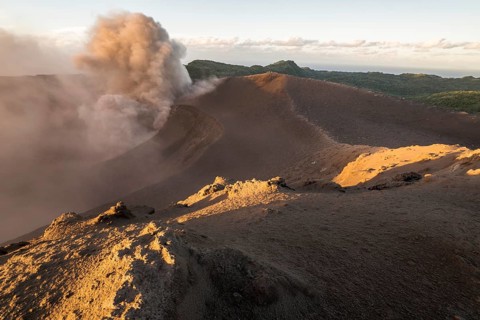People on the crater rim of Mount Yasur volcano