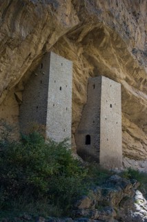 Chechen watchtowers under overhanging cliff on the Argun river