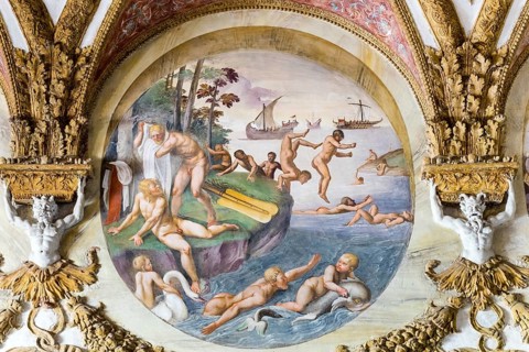 Naked men jump and splash in the water