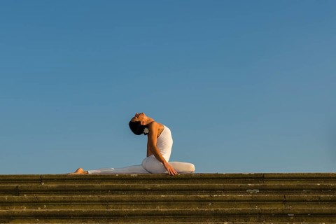 Young woman practising Hatha yoga