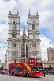 Red double-decker bus in front of Westminster Abbey