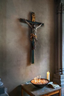 Crucifix and votive candles