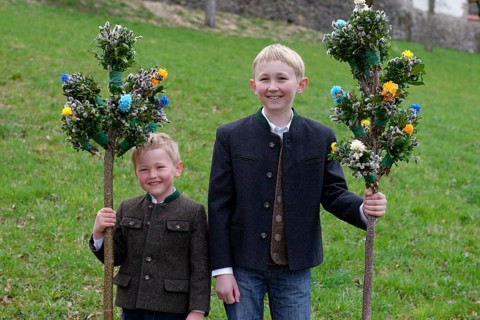 Two boys with palm branches