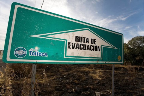 Evacuation sign in a village near the volcano Popocatepetl
