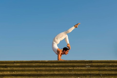 Young woman practising Hatha yoga