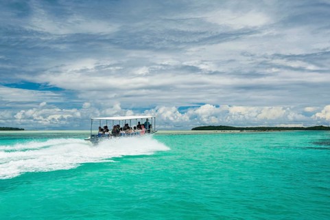 Tourist boat crossing an artificial canal