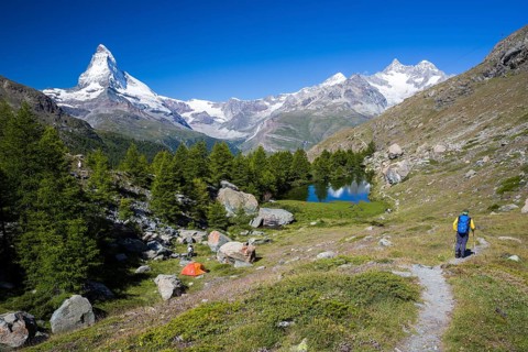 Hiker and a wild camper at Grindjisee lake