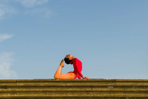 Young woman practising Hatha yoga