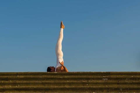 Young woman practising Hatha yoga