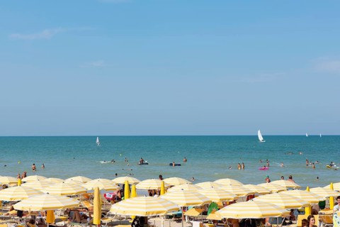 Bathers and parasols on the beach
