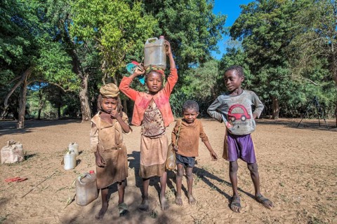 Children carrying water from the river