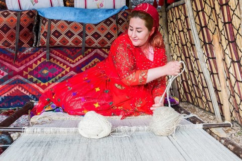 Qashqai woman weaving a carpet