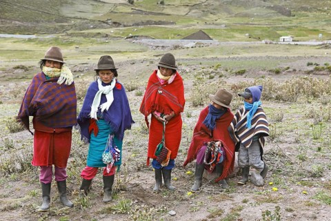 Girls with traditional felt hats offer handmade souvenirs for sale