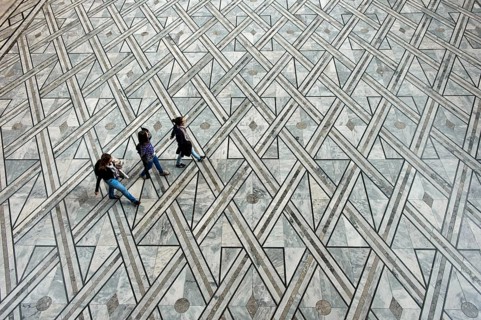 Visitors crossing the Central Hall of the Oslo City Hall