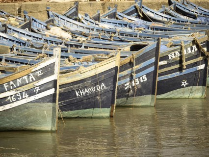 Old blue fishing boats in the port of Essaouira